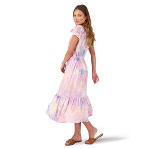 A model is twirling with the this is willow sustainable Quinn midi-dress in pink ecovero swinging out to her left.